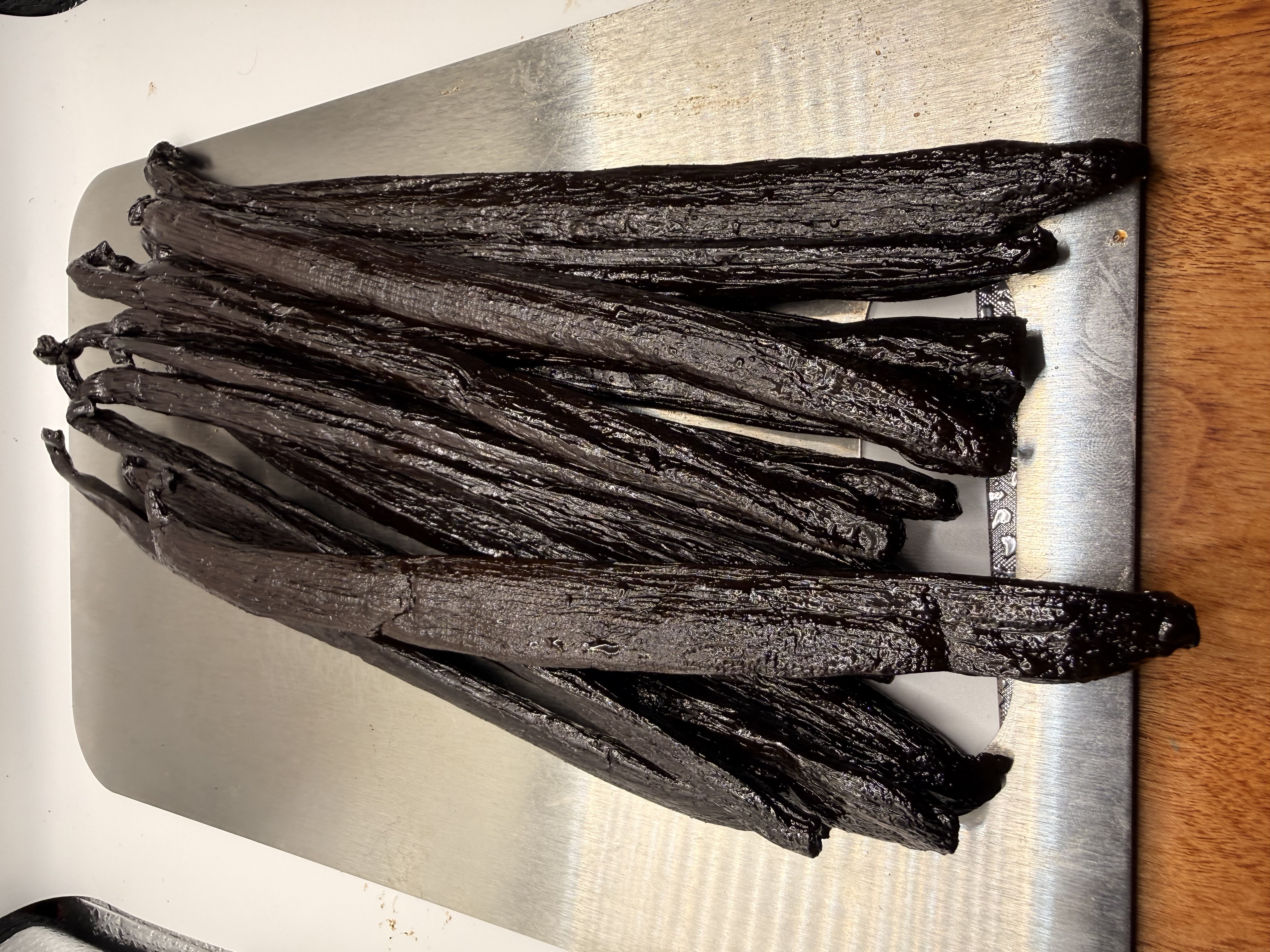 Madagascar Grade A Pompona Vanilla Beans — pile of large, plump gourmet pods