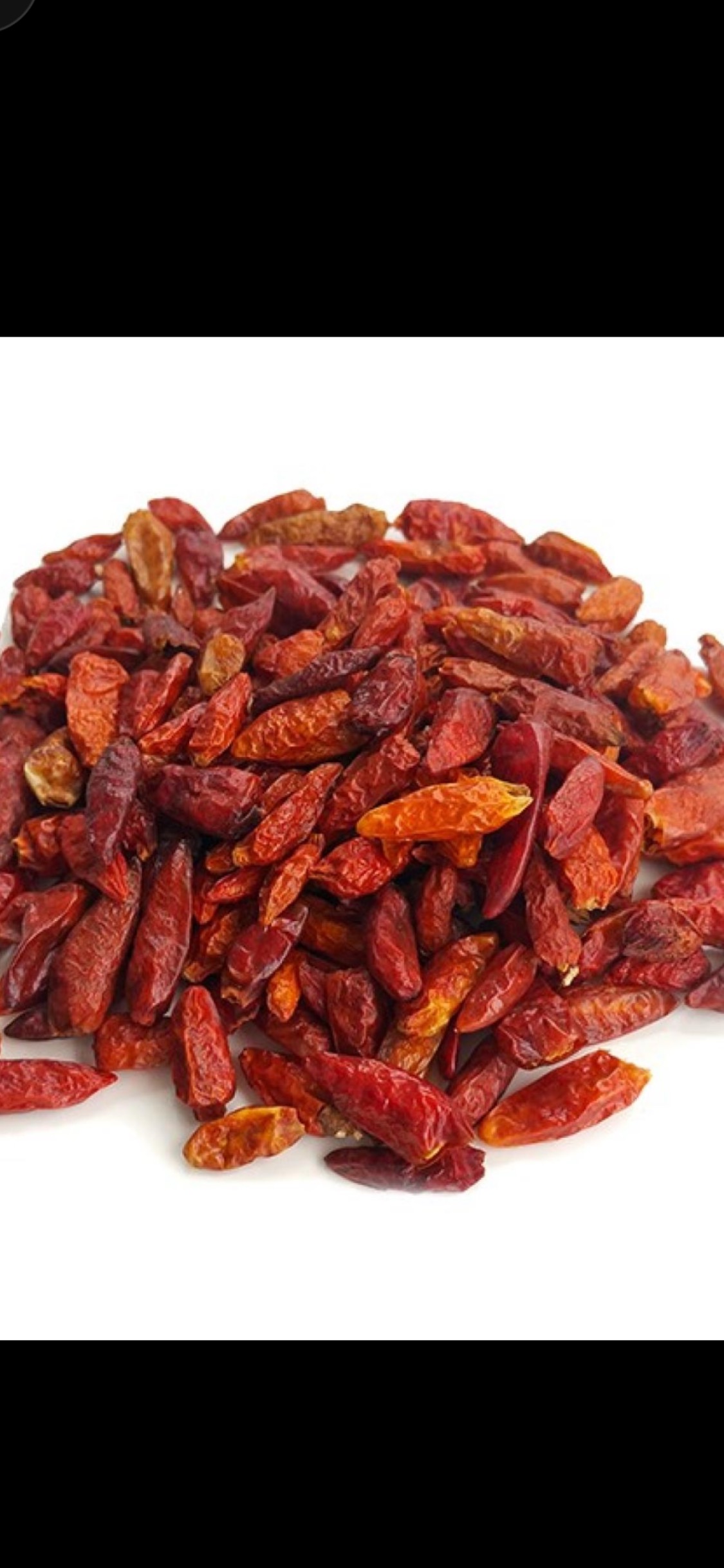 Josie's Sweet Caviar Red Bird Eye Chili — pile of small dried red chilies